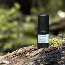Indlæs billede til gallerivisning Product shot of ReBoost – Hyaluronic Acid Booster on a log in nature
