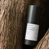 Product shot of ReFresh – Cleansing Gel between tree trunks