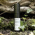 Product shot of ReMoisturize – Night Cream standing on forest floor in front of a trunk with moss